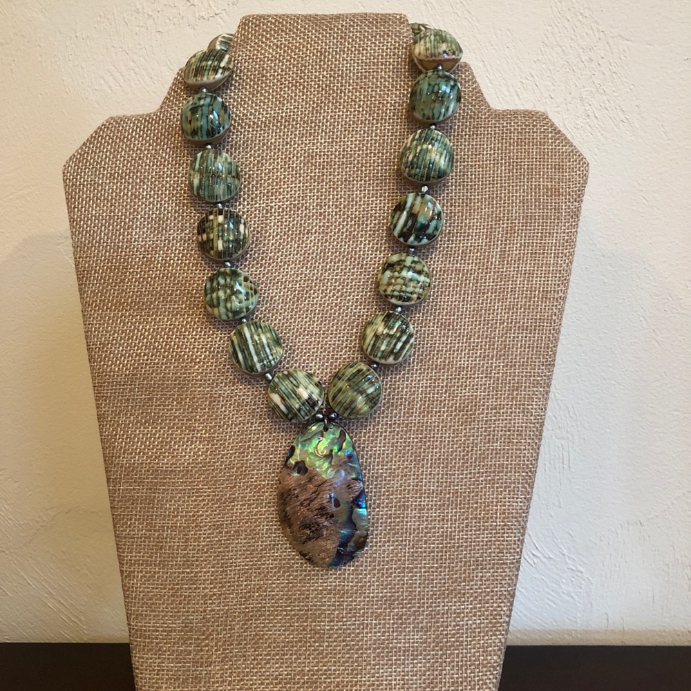 Handmade green turbo shell necklace.